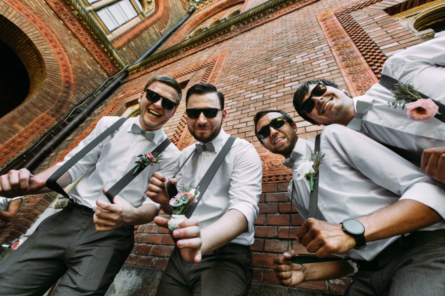 Funny groomsmen in the sunglasses and bow-ties